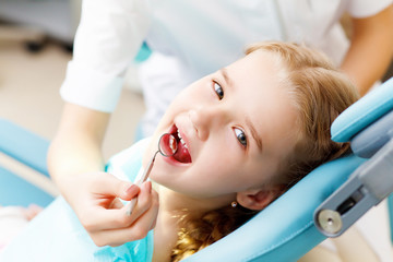 Little girl visiting dentist