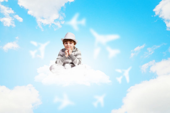 Boy sitting on cloud