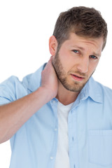 Obraz premium Trendy model having a painful neck and looking at camera