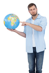 Charming model holding a globe on right hand
