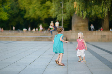 Two little sisters having fun together