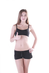 Naklejka premium Fitness girl. Thumb up.