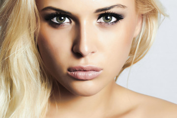 beautiful blond girl with green eyes.woman.professional make-up