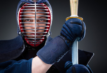 Close up of kendo fighter with shinai
