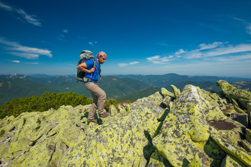 Obraz premium Hiker makes his way in Carpathian mountains