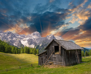 Shack on a mountain meadow - Sunset with fields and peaks