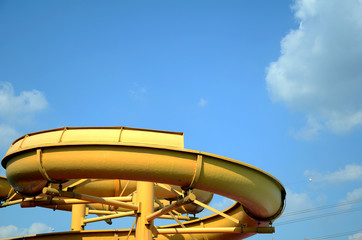 Yellow slider in water amusement park.