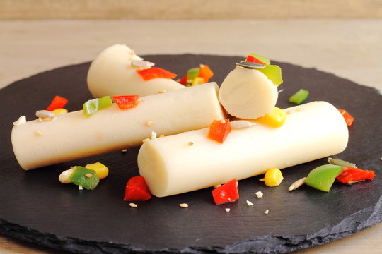 Ensalada de palmitos con pimientos, ma&iacute;z dulce y frutos secos