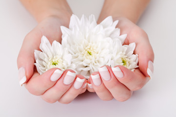 Obraz na płótnie Canvas white flower with hands
