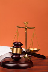 judge gavel,books and scales of justice on table