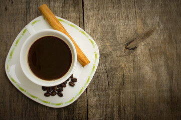 Coffee Cup with beans and cinnamon stick