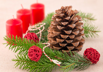 Christmas decoration: fir sprig,candles, cones