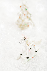 horse christmas decoration on white snow background