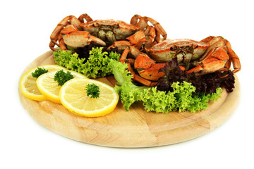 Boiled crabs on wooden board, isolated on white