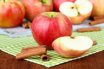 Ripe apples with with cinnamon sticks