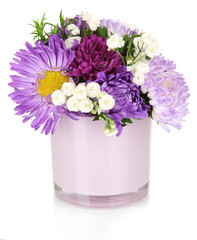 Beautiful bouquet of bright flowers in glass vase, isolated