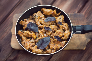 Roasted pork, rustic wooden background, high angle view
