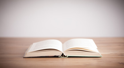 Open book on wooden deck