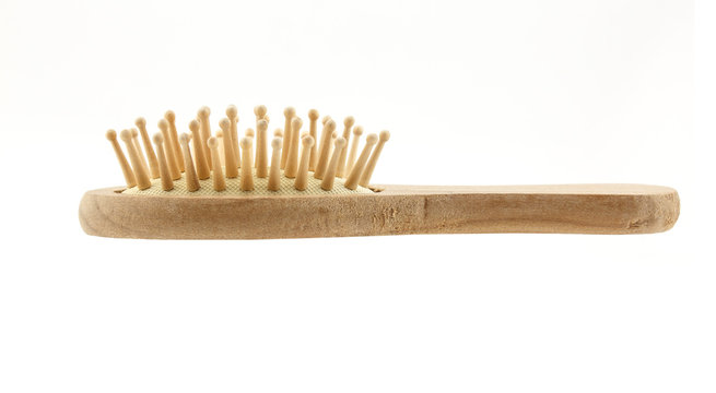 Wooden hair brush isolated on white background