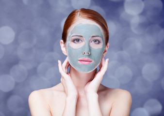 Redhead girl in cream mask