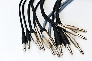 Guitar cables on white background © pepgooner