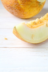 slices of fresh and fragrant melon on the white boards