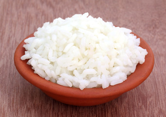 Fototapeta na wymiar Cooked rice on a brown pottery