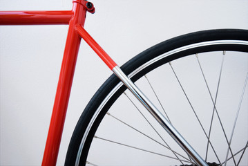 Red bicycle on whitebackground