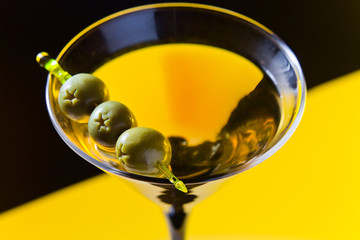 martini with green olives