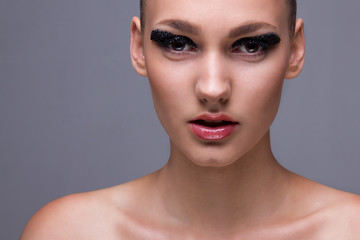 Closeup of perfect fashionable model with creative makeup