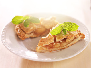 apple pie with mint garnish in warm sunlight