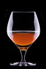 Cognac or brandy on a black