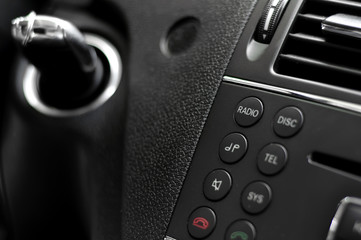 Close-up of modern car cockpit controls and phone commands