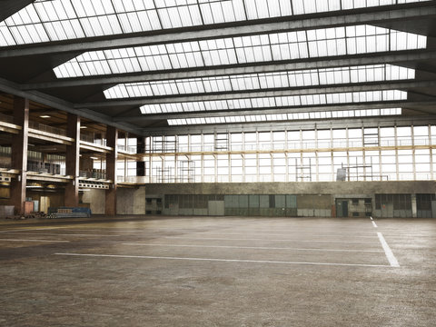 Large Interior grunge framed warehouse with an empty floor .