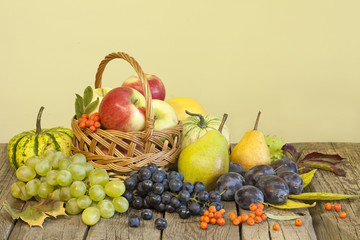 Fruits and vegetables in autumn season on vintage wooden boards