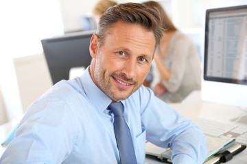 Fototapeta premium Handsome businessman sitting in office