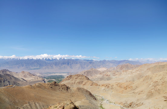 Undulating Ladakh range & snowcapped Zansker range, HDR