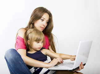 Mom and daughter working on laptop