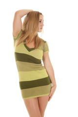 woman green stripe dress stand one hand up