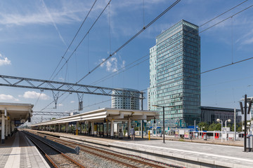 Fototapeta premium Railway station with office buildings in Amsterdam