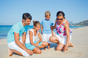 Fototapeta premium family having fun on beach