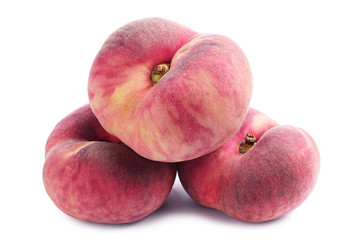 Three flat peaches