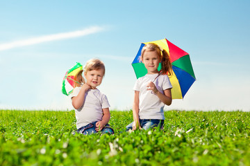 Two little girls  in outdoor park  at sunny day. Sisters in the