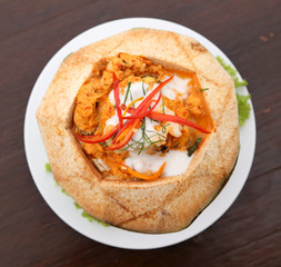 Steamed fish and seafood with curry paste in coconut