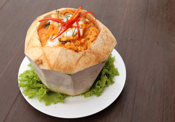 Steamed fish and seafood with curry paste in coconut