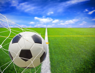 Fototapeta premium soccer ball in goal net