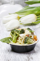 Vegetarian pasta with broccoli, ricotta, basil, carrot and olive