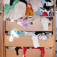 mess of clothing in the closet