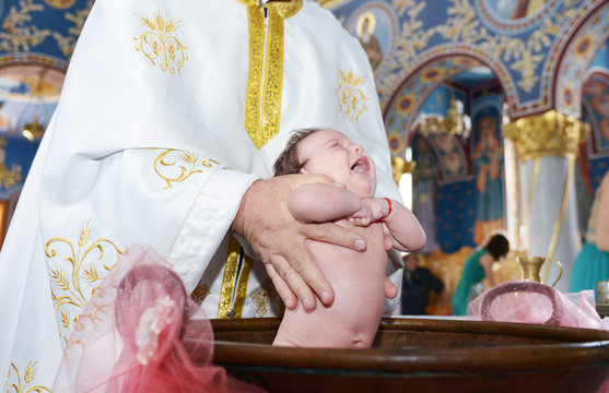 Baptizing newborn baby