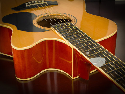 Acoustic guitar on table